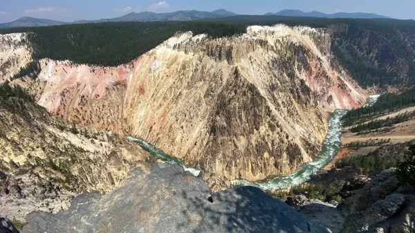 a canyon with a mountain in the background